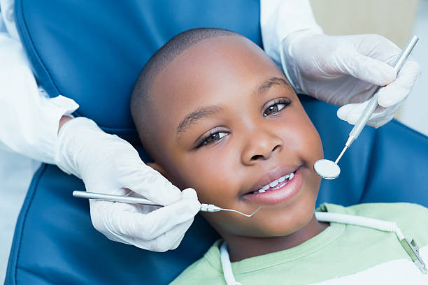 istock Close up of boy having his teeth examined 532336295
