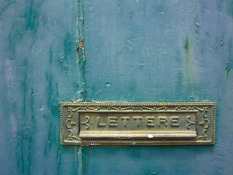 ornate letterbox on old door