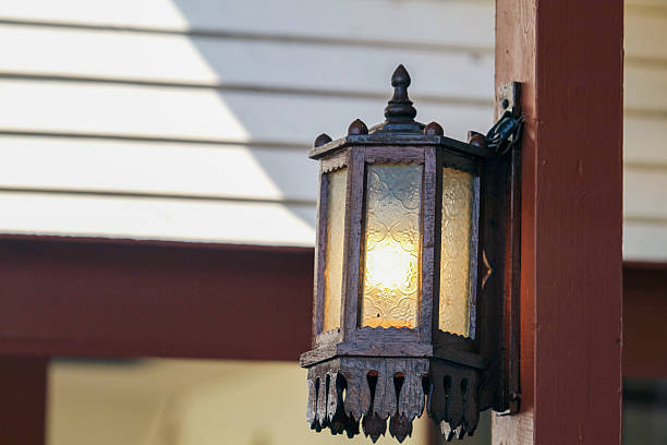 istock vintage Lamp hanging on  wooden wall background 532337537