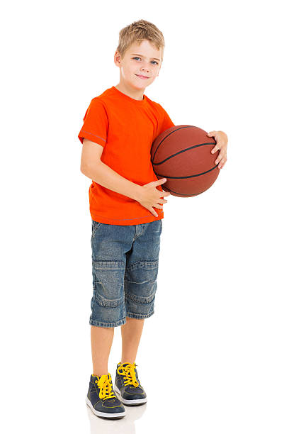 istock boy holding basketball 532337767