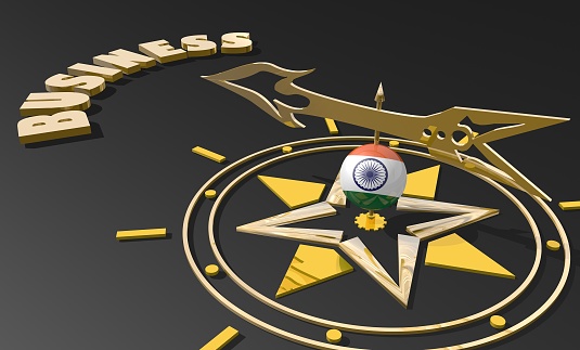 Red arrow of a compass pointing to the word business. 3D Rendering. India business metaphor