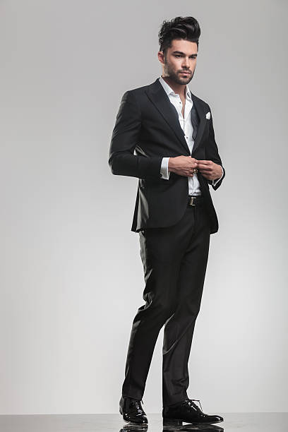 istock handsome young man closing his tuxedo. 532339257