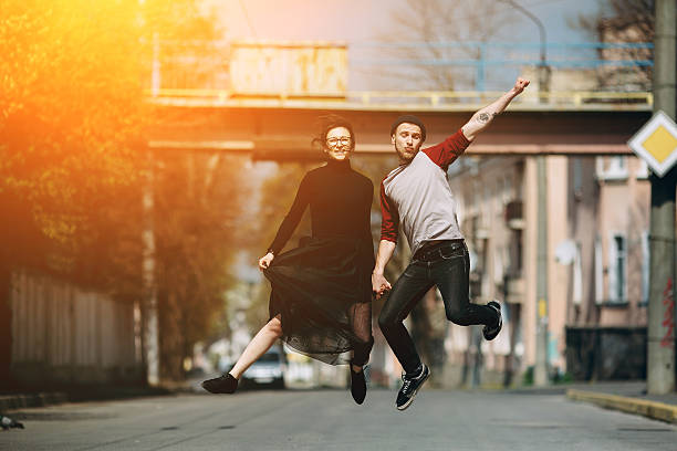 istock Beautiful young couple jumping 532341486