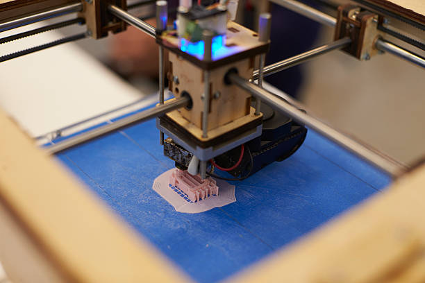 istock Close Up Of 3D Printer Operating In Design Studio 532342688