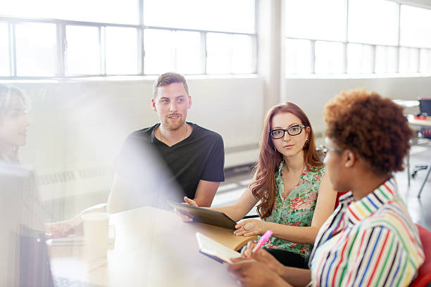 istock Unposed group of creative business people in an open concept 532343338