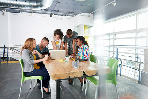 istock Multi ethnic group of succesful creative business people using a 532343842