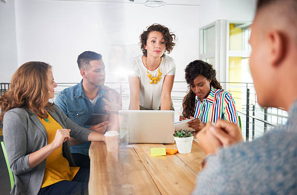 istock Multi ethnic group of succesful creative business people using a 532343900