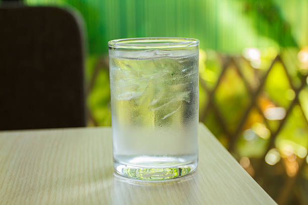 istock glass of water on wood table 532344286