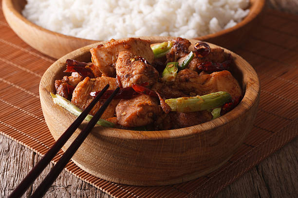 istock traditional kung pao chicken in a bowl close-up. horizontal 532345248