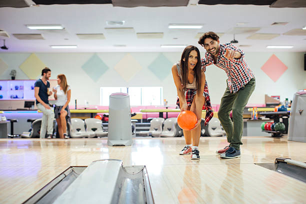istock Cheerful Friends Bowling Together 532345406