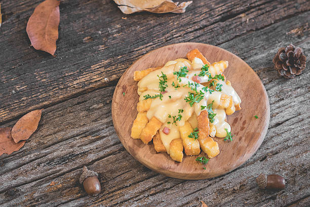 istock french fries with cheese on wooden 532345954