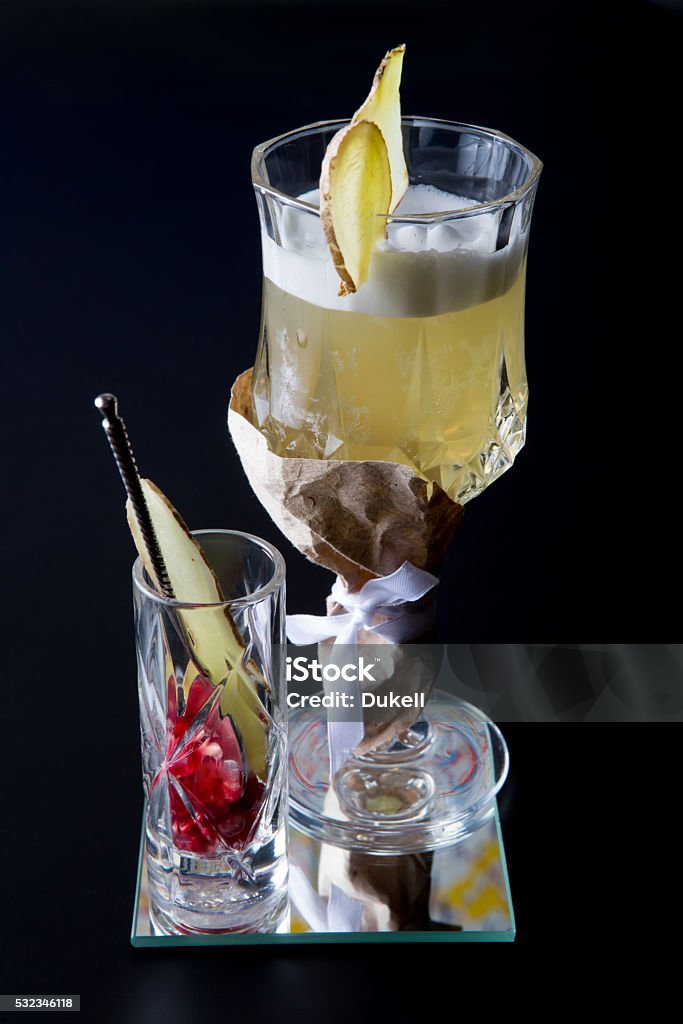 Fancy alcohol cocktail Fancy alcohol cocktail with ginger on black background Alcohol - Drink Stock Photo