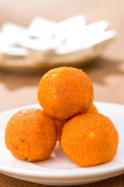 Indian sweets Motichoor Laddu Pile of orange Indian sweets Motichoor Laddu or Laddoo india sweets stock pictures, royalty-free photos & images