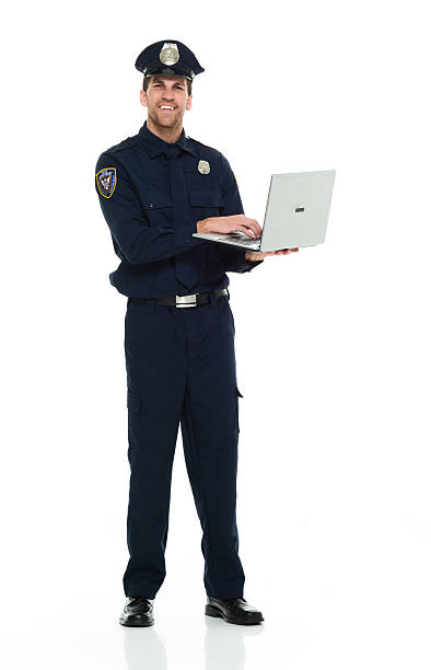 istock Smiling police working on laptop 532347044