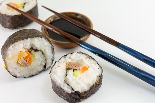 Sushi rolls served with wooden chopsticks