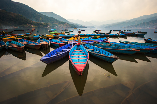 twilight with boats on Phewa lake, Pokhara, Nepal