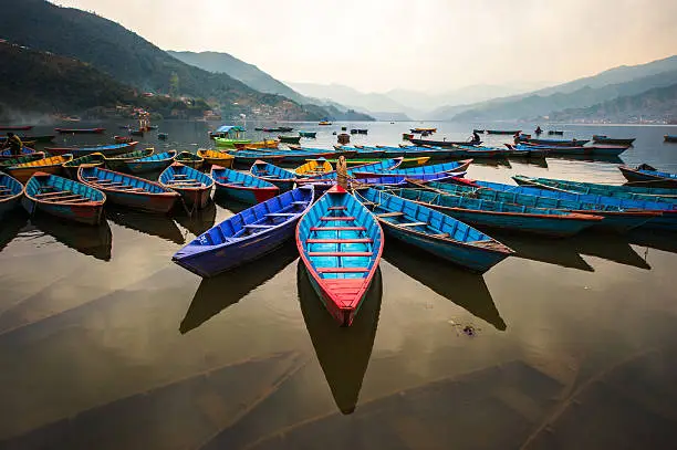 twilight with boats on Phewa lake, Pokhara, Nepal