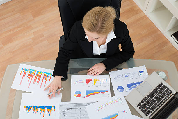 istock Businesswoman Analyzing Financial Graphs 532348106