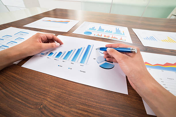 istock Businessperson Hands With Graphs 532349372