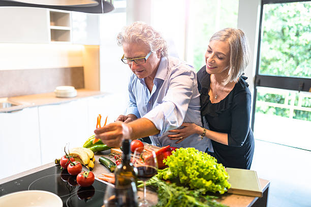 istock busy mature couple cooking in the kitchen 532351290