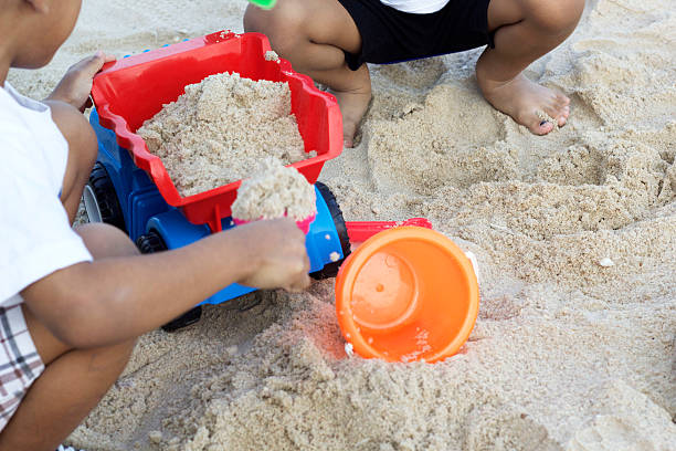 istock Children playing toy on sand 532352073