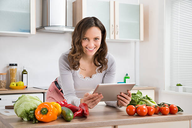 istock Woman With Digital Tablet And Vegetables 532352502