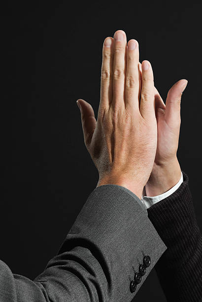 istock Businesspersons giving high five each other 532352781