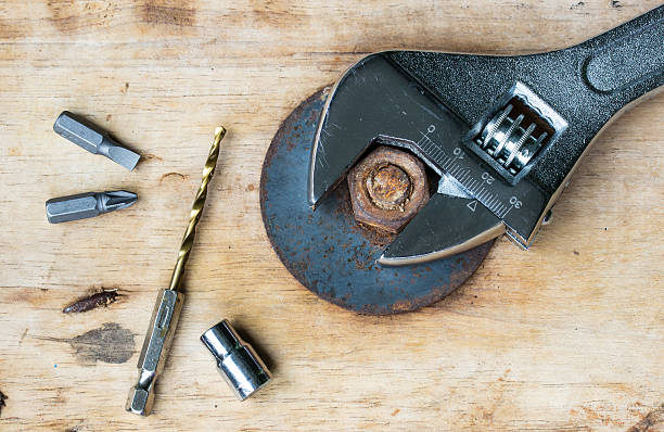 Pliers Drill, screwdriver and nut on a wooden floor. Pliers Drill, screwdriver and nut on a wooden floor. knurl stock pictures, royalty-free photos & images