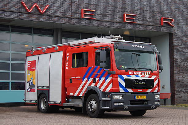 Dutch Fire Engine - brandweerauto Almere, The Netherlands - May 19, 2016: Dutch fire truck standing in font of a fire station. Nobody in de vehicle. almere photos stock pictures, royalty-free photos & images