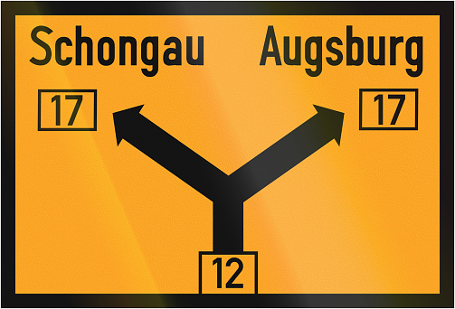 Old design (1937) of a German direction sign on a federal road showing the way to Schongau and Augsburg.