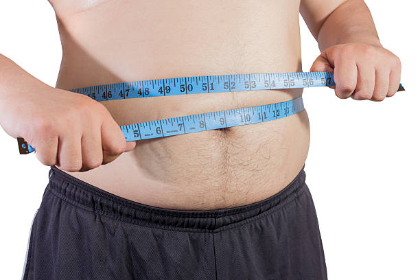 istock Fat man with measurement tape 532355274
