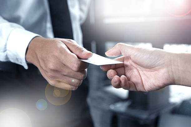 istock business executive exchanging business card 532355420