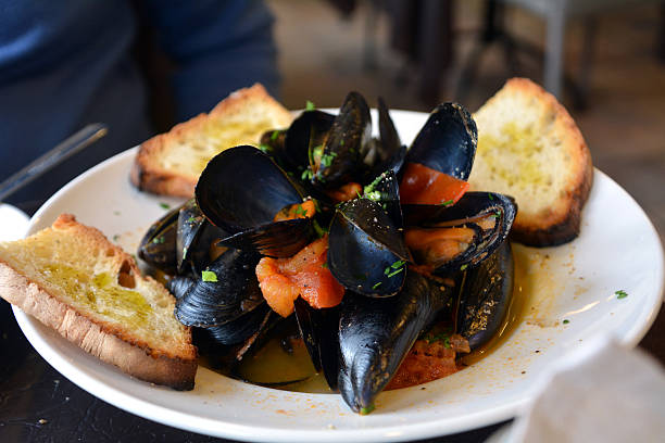 istock Steamed mussels on a white bowl 532355742