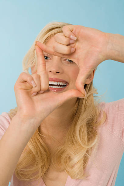 istock Blonde woman making hand gesture, portrait 532356075