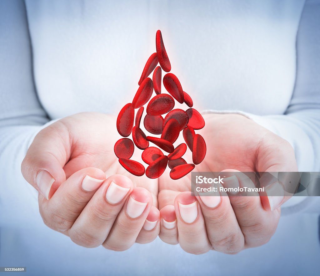 blood donation blood cells in hands - shape blood drop Blood Cell Stock Photo