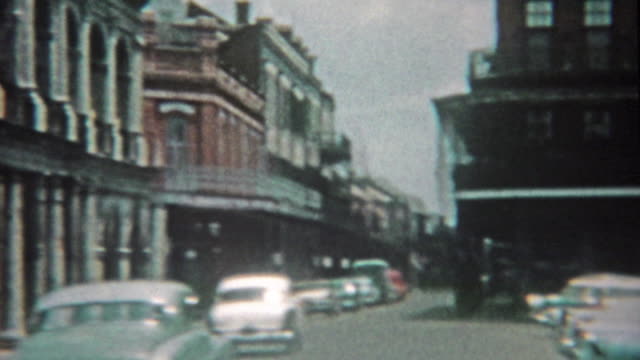 1959: New Orleans bourbon street, jackson square, and stone crypts cemetery mausoleums.