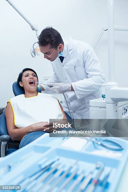 Male Dentist Examining Womans Teeth Stock Photo - Download Image Now - Dentist, Tray, 20-29 Years