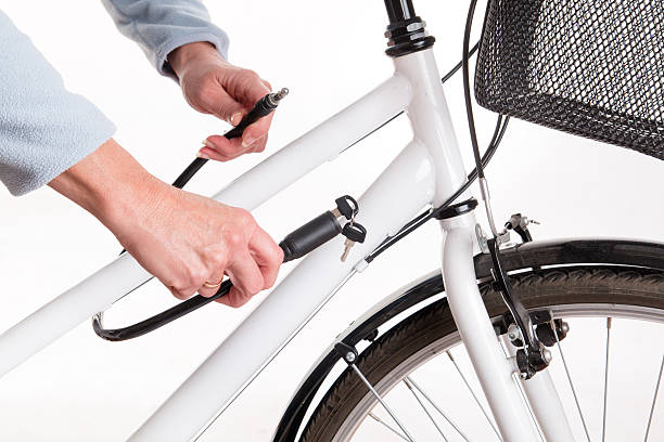 istock Securing the bike with a chain with a key 532358149