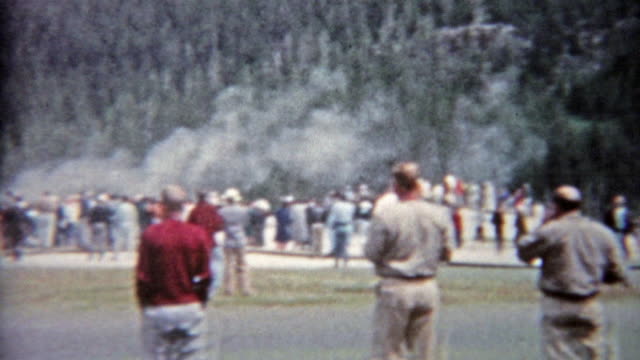1959: Old faithful geyser in Yellowstone park family vacation visit.