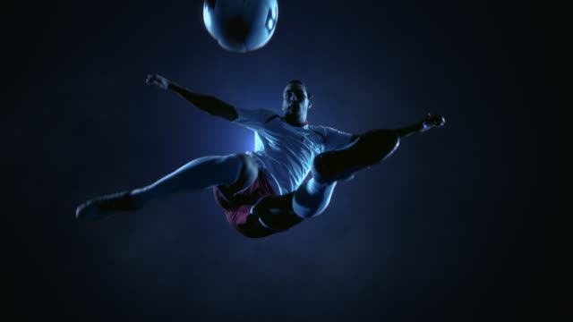 Soccer Player Kicking Ball in jump