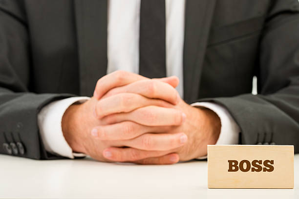 istock Boss Text on Wooden Piece in Front Businessman 532371993