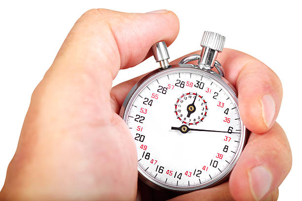 Hand and stopwatch stock photo