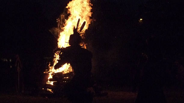 Native American in front of Bonfire