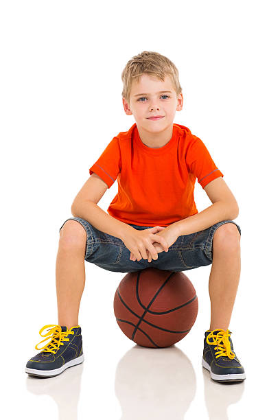 istock kid sitting on a basketball 532374037