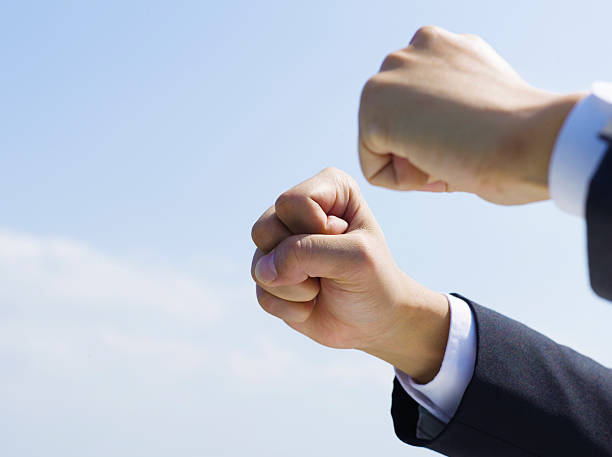 istock The hands of two businessmen stretched 532374235