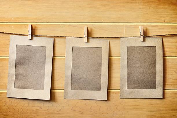 istock Photo Frame hanging on wooden wall 532375245