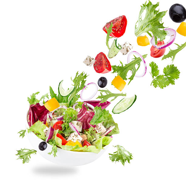istock Fresh salad with flying vegetables ingredients 532375705