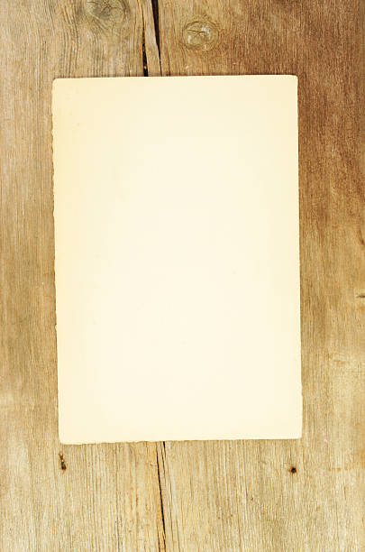 istock old paper on wood 532375733
