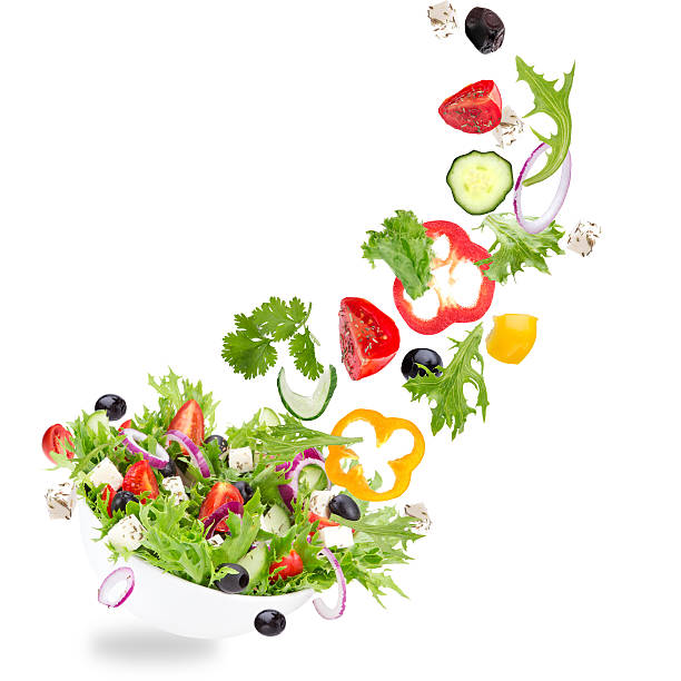 istock Fresh salad with flying vegetables ingredients 532375777