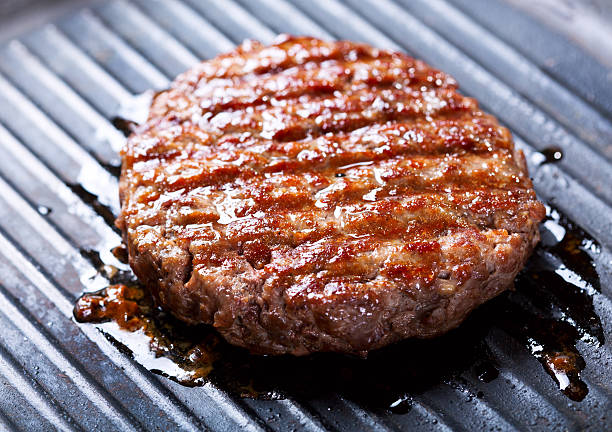 istock hamburgers on the grill 532376775